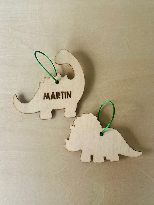 Adorno navideño dinosaurio