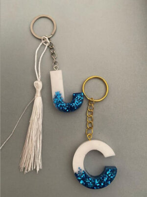 2 Llaveros Blanco y Azul Purpurina